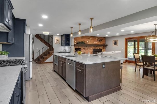 Dining room, Interior, Kitchen, Pendant Lights, Recessed Lighting, Stainless Steel Appliances, Stone Walls, Wood Texture Flooring