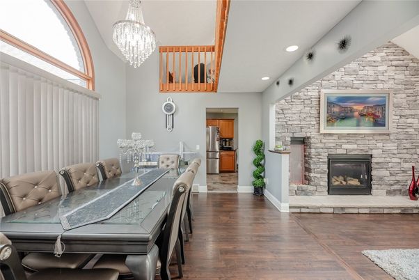 Chandelier, Dining room, Fireplace, Interior, Recessed Lighting, Stone Walls, Wood Texture Flooring