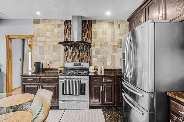 Interior, Kitchen, Recessed Lighting, Stainless Steel Appliances, Stone Walls