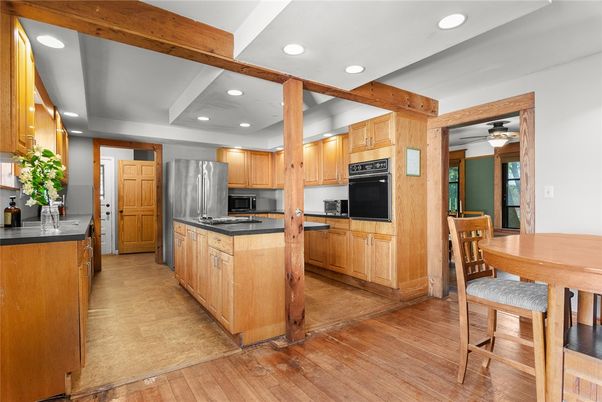 Dining room, Interior, Kitchen, Recessed Lighting, Stainless Steel Appliances, Wooden Beams, Wood Texture Flooring