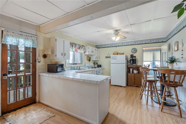 Interior, Kitchen, Tile Countertops, Wood Texture Flooring