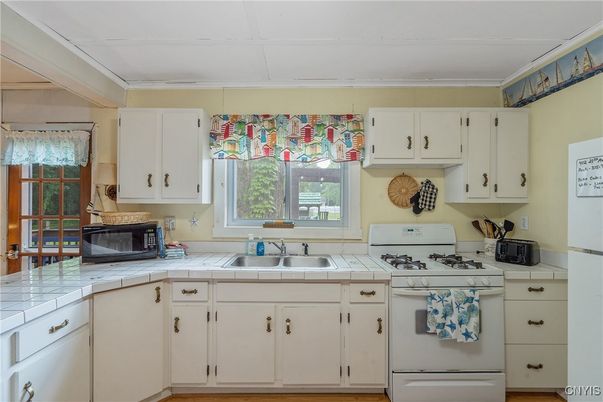 Interior, Kitchen, Tile Countertops, Wood Texture Flooring