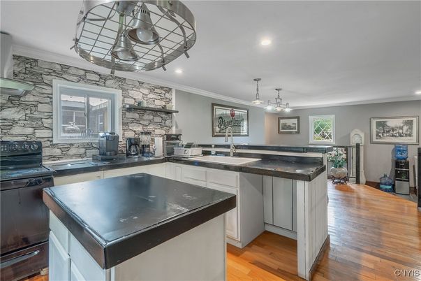 Fireplace, Interior, Kitchen, Pendant Lights, Recessed Lighting, Stone Walls, Wood Texture Flooring