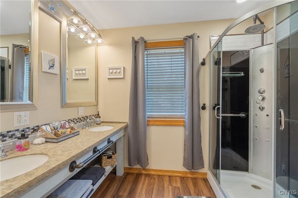 Bathroom, Dual Sink Vanities, Glass Shower, Interior, Wood Texture Flooring