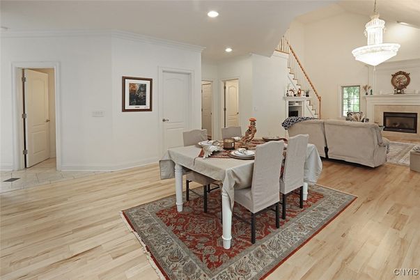 Dining room, Fireplace, Interior, Living room, Pendant Lights, Recessed Lighting, Wood Texture Flooring