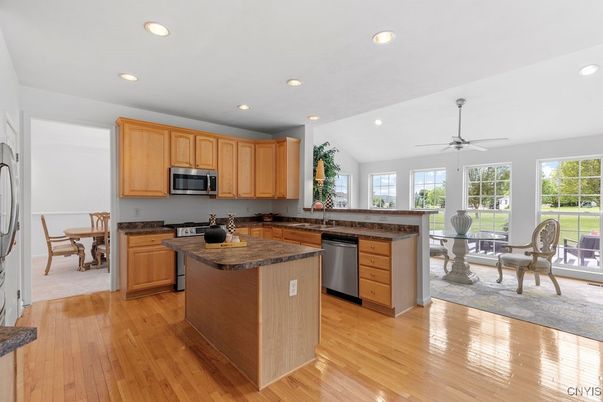 Dining room, Interior, Kitchen, Recessed Lighting, Stainless Steel Appliances, Wood Texture Flooring