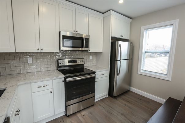 Interior, Kitchen, Recessed Lighting, Stainless Steel Appliances, Wood Texture Flooring