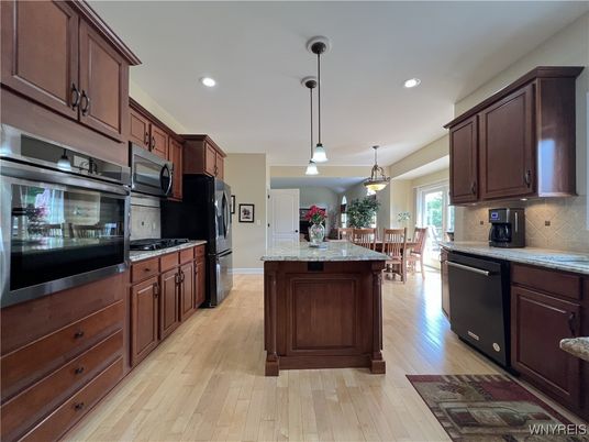 Dining room, Interior, Kitchen, Pendant Lights, Recessed Lighting, Stainless Steel Appliances, Wood Texture Flooring