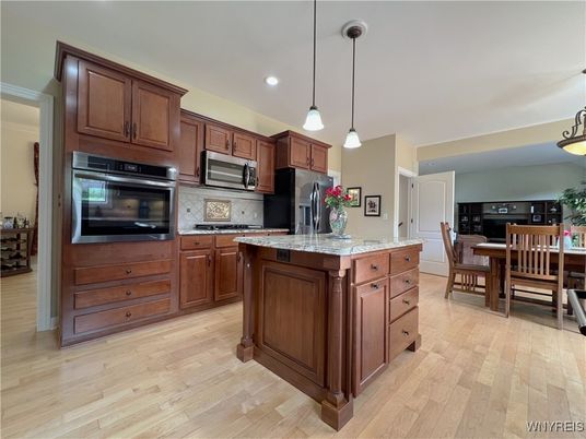 Dining room, Interior, Kitchen, Pendant Lights, Recessed Lighting, Stainless Steel Appliances, Wood Texture Flooring