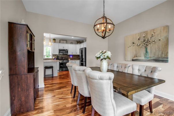 Chandelier, Dining room, Interior, Kitchen, Pendant Lights, Recessed Lighting, Stainless Steel Appliances, Wood Texture Flooring