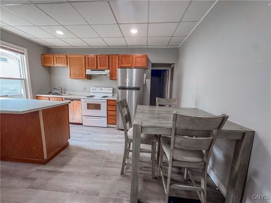 Dining room, Interior, Kitchen, Recessed Lighting, Stainless Steel Appliances, Wood Texture Flooring