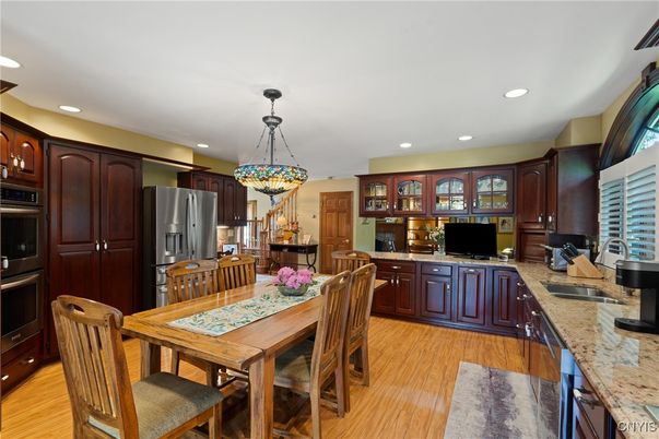Dining room, Interior, Kitchen, Pendant Lights, Recessed Lighting, Stainless Steel Appliances, Wood Texture Flooring