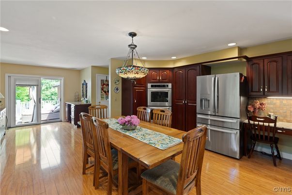 Dining room, Interior, Kitchen, Pendant Lights, Recessed Lighting, Stainless Steel Appliances, Wood Texture Flooring