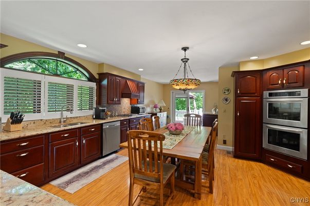 Dining room, Interior, Kitchen, Pendant Lights, Recessed Lighting, Stainless Steel Appliances, Wood Texture Flooring