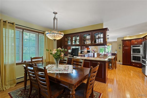 Dining room, Interior, Kitchen, Pendant Lights, Recessed Lighting, Stainless Steel Appliances, Wood Texture Flooring