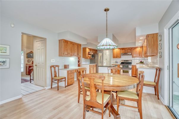 Dining room, Interior, Kitchen, Pendant Lights, Recessed Lighting, Stainless Steel Appliances, Wood Texture Flooring