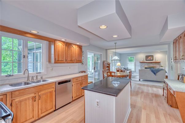 Dining room, Fireplace, Interior, Kitchen, Living room, Pendant Lights, Recessed Lighting, Stainless Steel Appliances, Wood Texture Flooring