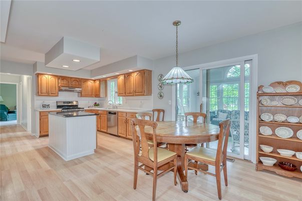 Dining room, Interior, Kitchen, Pendant Lights, Recessed Lighting, Stainless Steel Appliances, Wood Texture Flooring