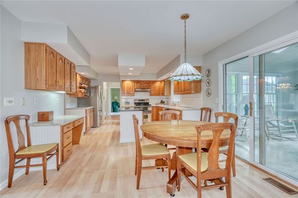 Dining room, Interior, Kitchen, Pendant Lights, Recessed Lighting, Stainless Steel Appliances, Wood Texture Flooring