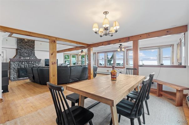 Chandelier, Dining room, Fireplace, Interior, Living room, Water, Wood Texture Flooring
