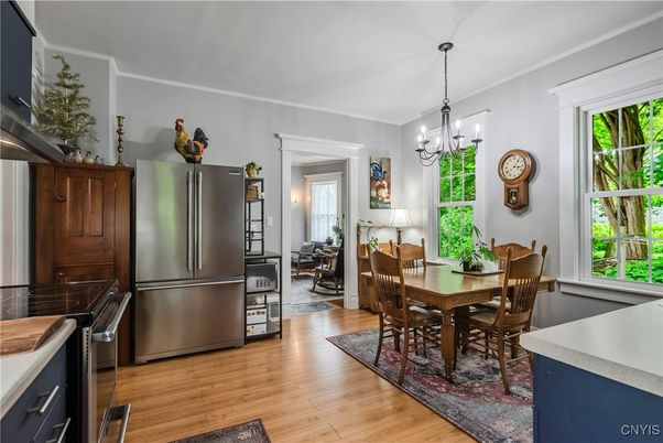 Chandelier, Dining room, Interior, Kitchen, Stainless Steel Appliances, Wood Texture Flooring