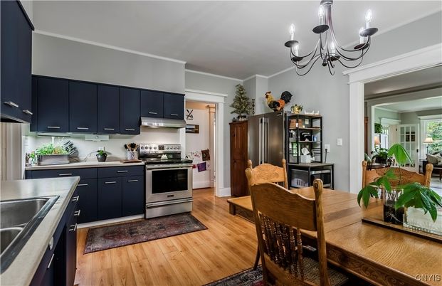 Chandelier, Dining room, Interior, Kitchen, Stainless Steel Appliances, Wood Texture Flooring