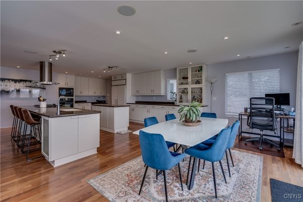 Dining room, Interior, Kitchen, Recessed Lighting, Stainless Steel Appliances, Wood Texture Flooring