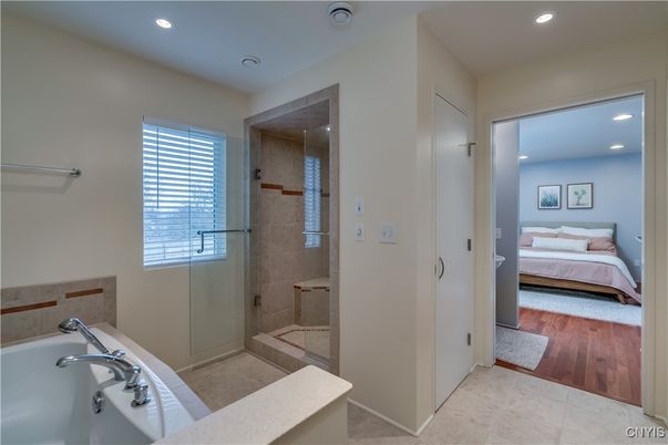 Bathroom, Bedroom, Glass Shower, Interior, Recessed Lighting, Wood Texture Flooring