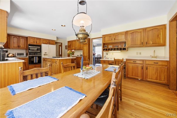 Dining room, Interior, Kitchen, Pendant Lights, Recessed Lighting, Stainless Steel Appliances, Wood Texture Flooring