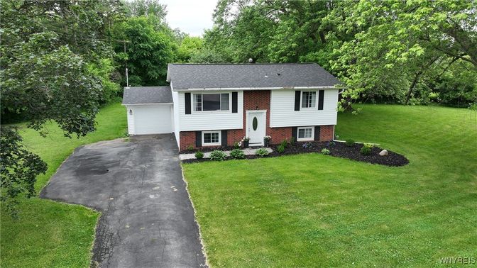 Attached, Backyard, Exterior, Facade, Brick Facade, Raised Ranch