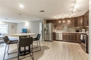 Dining room, Interior, Kitchen, Recessed Lighting, Stainless Steel Appliances, Wood Texture Flooring