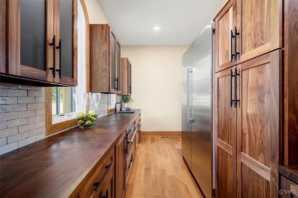 Interior, Kitchen, Recessed Lighting, Stainless Steel Appliances, Stone Walls, Wood Texture Flooring
