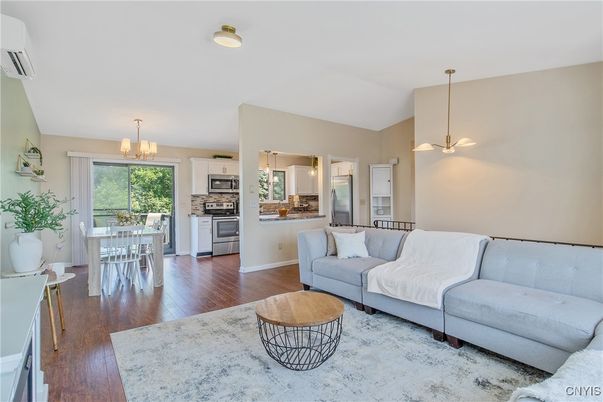 Chandelier, Dining room, Interior, Kitchen, Living room, Pendant Lights, Stainless Steel Appliances, Wood Texture Flooring