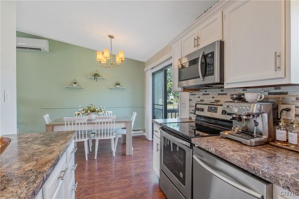 Chandelier, Dining room, Interior, Kitchen, Stainless Steel Appliances, Wood Texture Flooring
