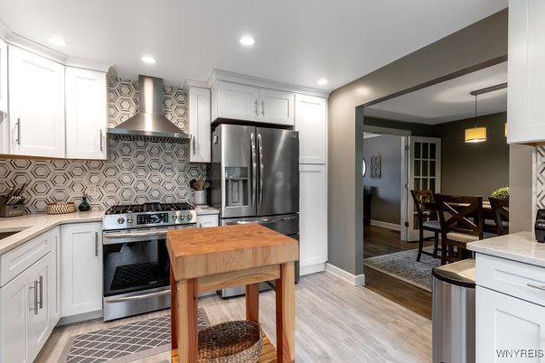 Dining room, Interior, Kitchen, Pendant Lights, Recessed Lighting, Stainless Steel Appliances, Wood Texture Flooring