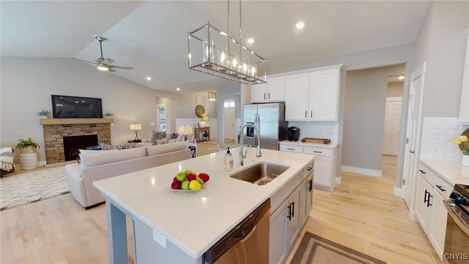 Fireplace, Interior, Kitchen, Living room, Pendant Lights, Recessed Lighting, Stainless Steel Appliances, Wood Texture Flooring
