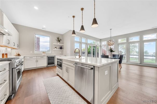 Chandelier, Dining room, Interior, Kitchen, Pendant Lights, Recessed Lighting, Stainless Steel Appliances, Wood Texture Flooring