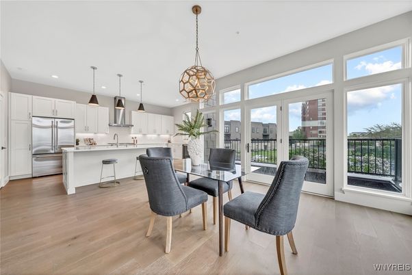 Dining room, Interior, Kitchen, Pendant Lights, Recessed Lighting, Stainless Steel Appliances, Wood Texture Flooring