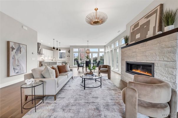 Chandelier, Dining room, Fireplace, Interior, Kitchen, Living room, Pendant Lights, Recessed Lighting, Stone Walls, Wood Texture Flooring