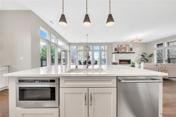 Fireplace, Interior, Kitchen, Living room, Pendant Lights, Stainless Steel Appliances, Wood Texture Flooring