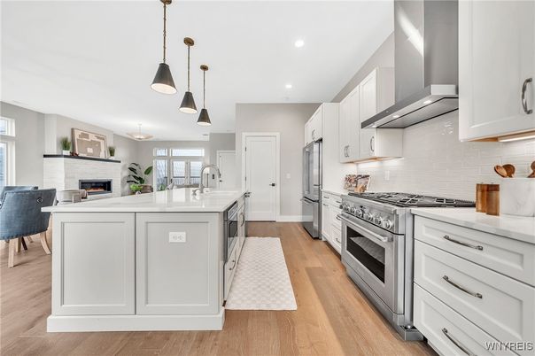 Fireplace, Interior, Kitchen, Pendant Lights, Recessed Lighting, Stainless Steel Appliances, Wood Texture Flooring