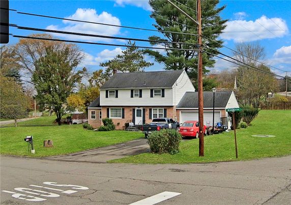 Attached, Backyard, Exterior, Facade, Brick Facade, Cape Cod
