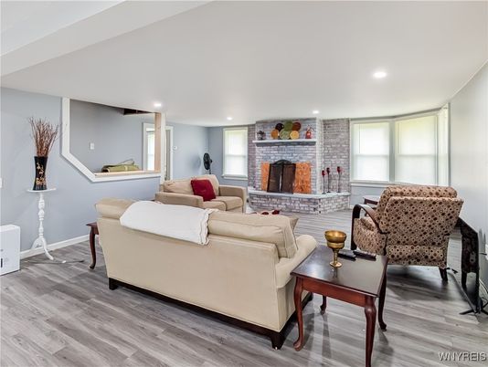 Fireplace, Interior, Living room, Recessed Lighting, Stone Walls, Wood Texture Flooring