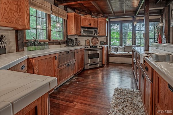 Interior, Kitchen, Living room, Pendant Lights, Stainless Steel Appliances, Tile Countertops, Wooden Beams, Wooden Ceilings, Wood Texture Flooring