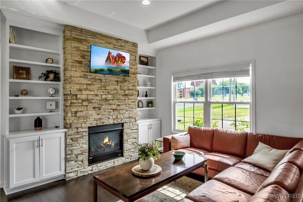 Fireplace, Interior, Living room, Recessed Lighting, Stone Walls, Wood Texture Flooring