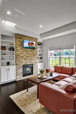 Fireplace, Interior, Living room, Recessed Lighting, Stone Walls, Wood Texture Flooring