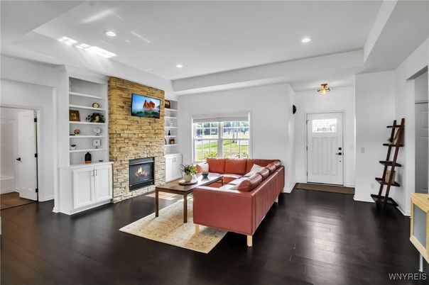 Fireplace, Interior, Living room, Recessed Lighting, Stone Walls, Wood Texture Flooring