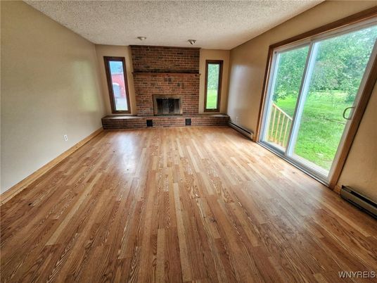 Empty room, Fireplace, Interior, Stone Walls, Wood Texture Flooring