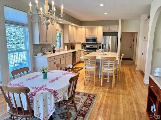 Chandelier, Dining room, Interior, Kitchen, Recessed Lighting, Stainless Steel Appliances, Wood Texture Flooring