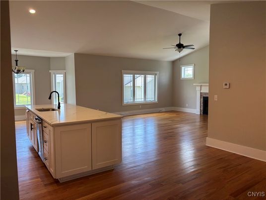 Empty room, Fireplace, Interior, Kitchen, Recessed Lighting, Wood Texture Flooring